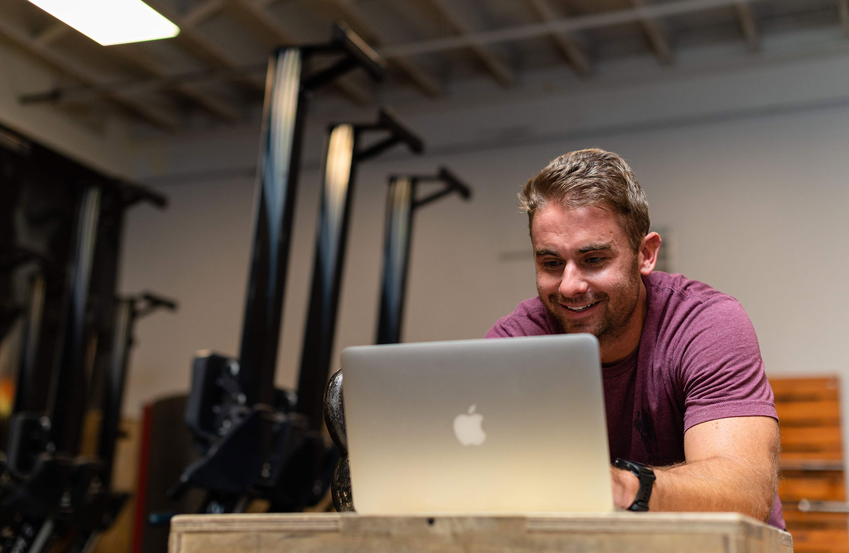 a male studio owner working on his laptop