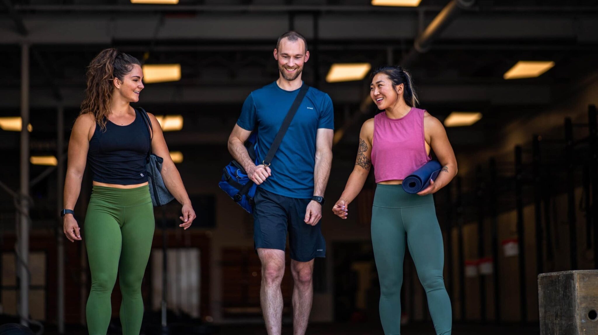 a group of athletes walking and smiling