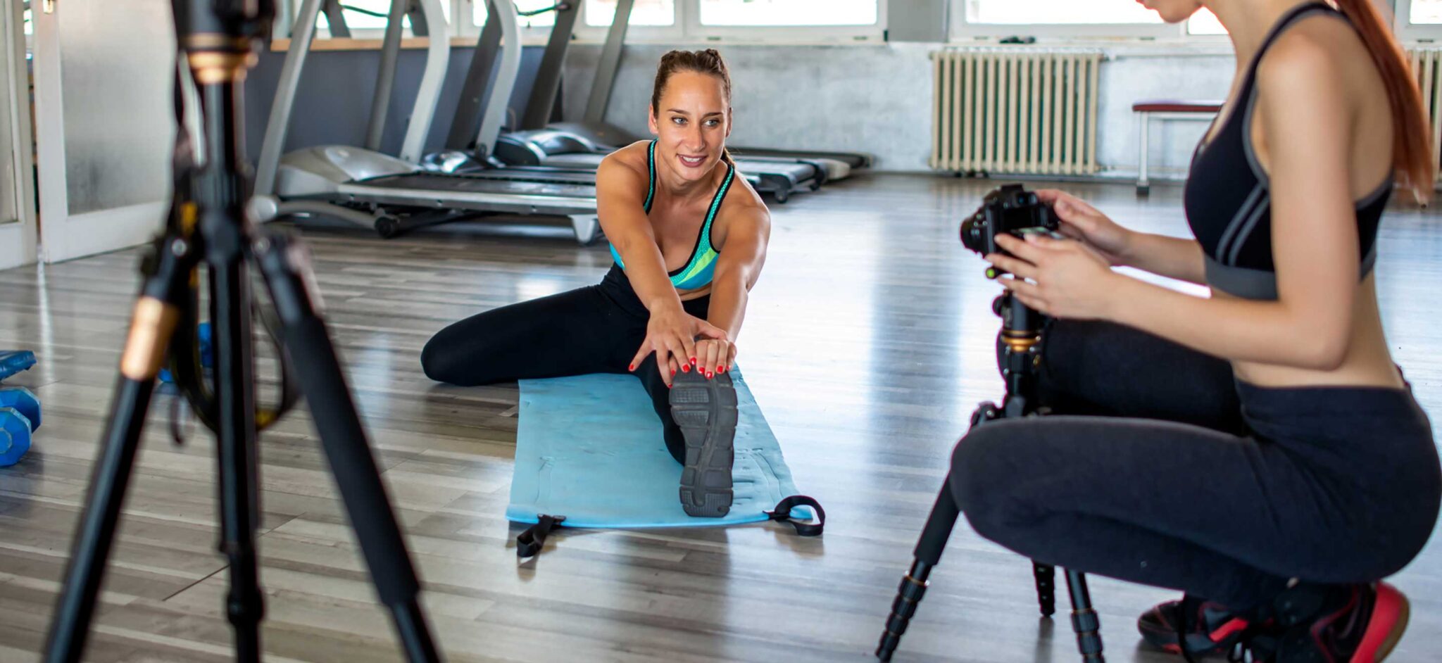 two ladies recording fitness video content