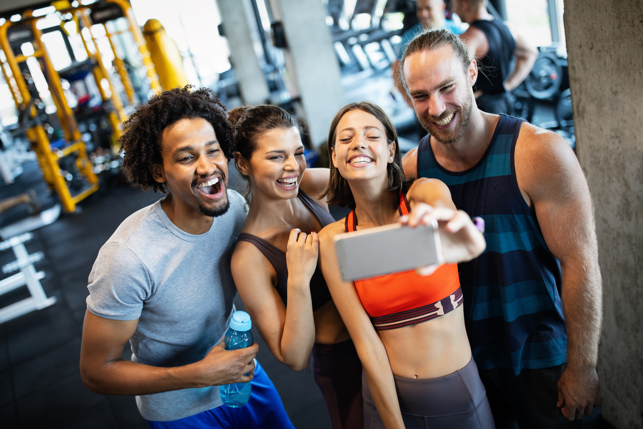 Friends having fun at the gym, making a selfie