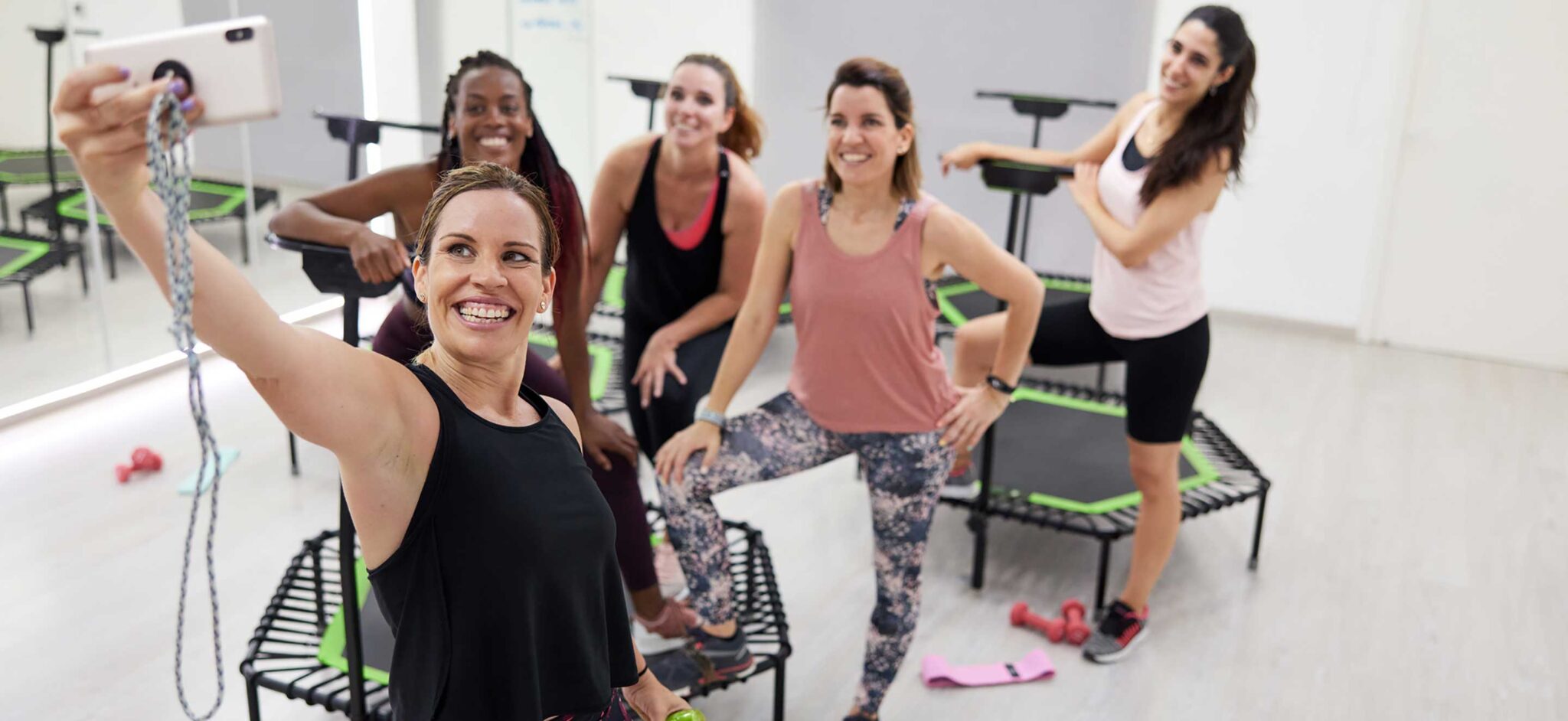 A group of ladies taking selfie at a fitness studio