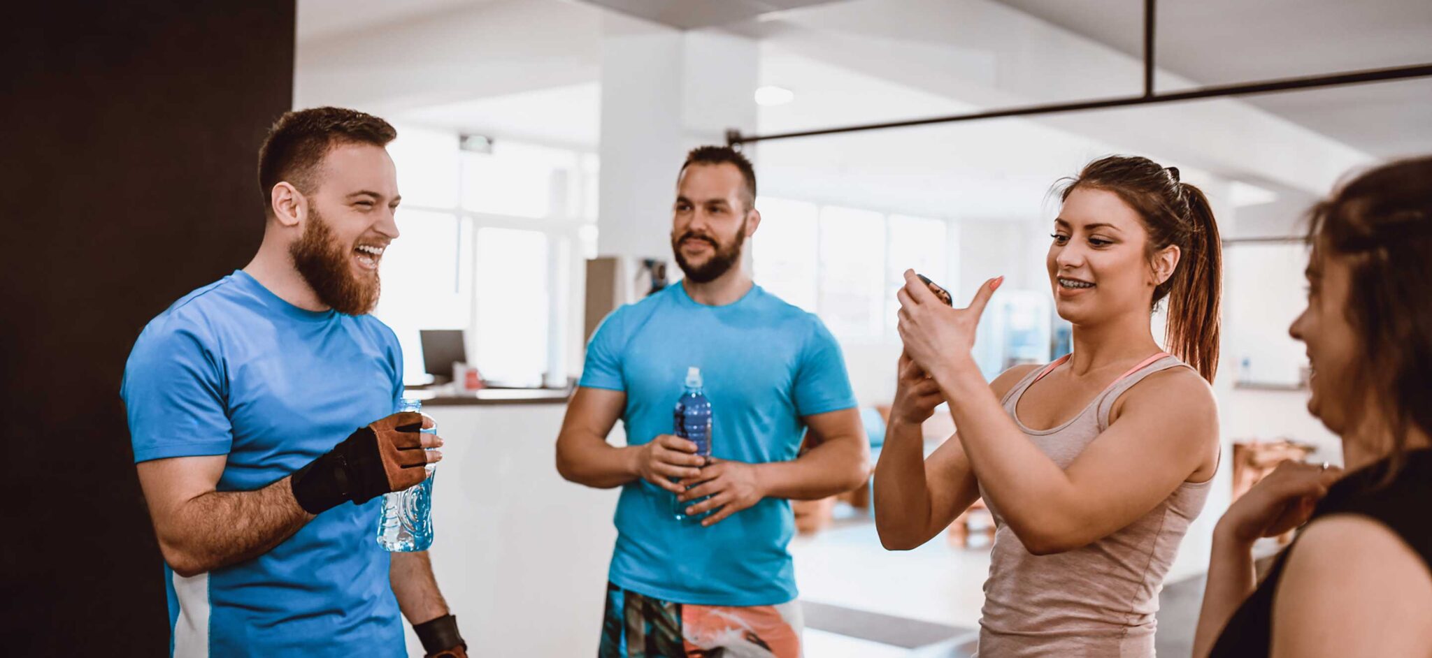 a group of fitness studio instructors talking