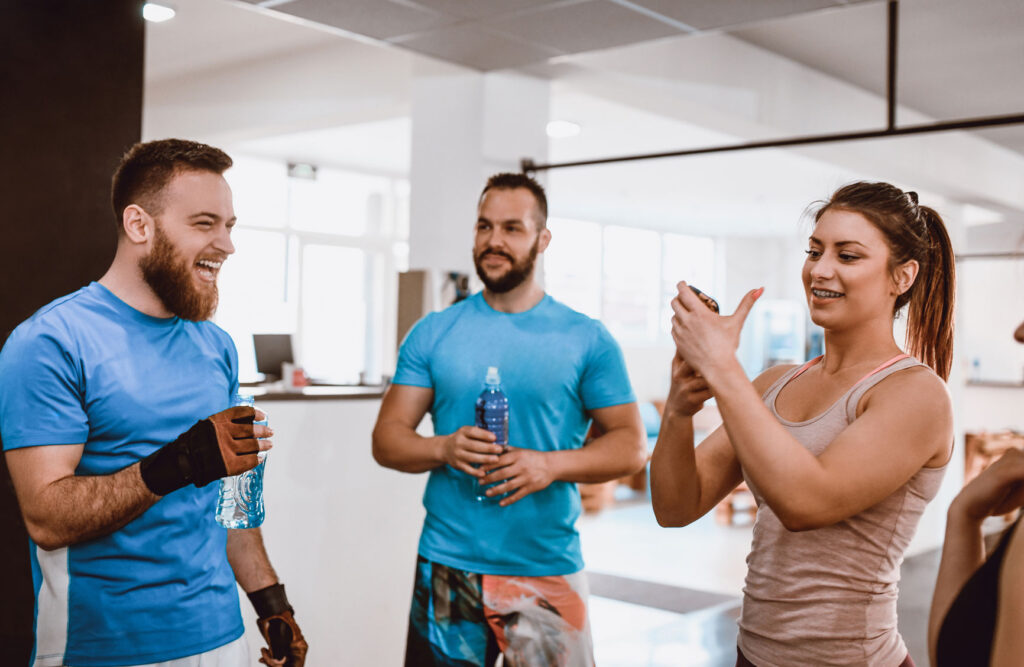 a group of fitness studio instructors talking