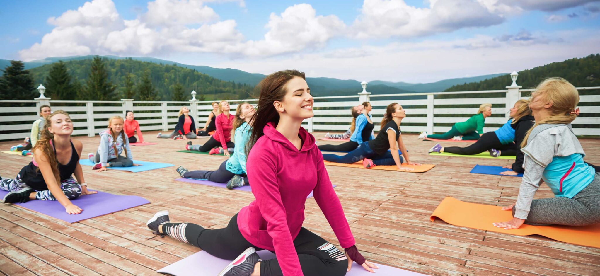 A group of ladies doing yoga outdoors