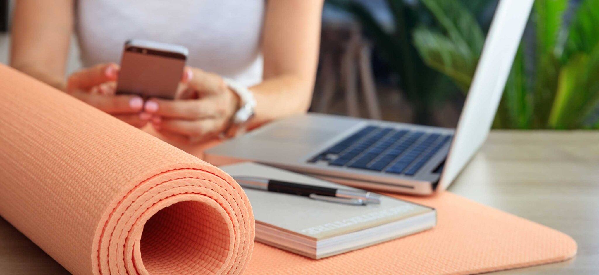 A woman researching different YTT certification programs