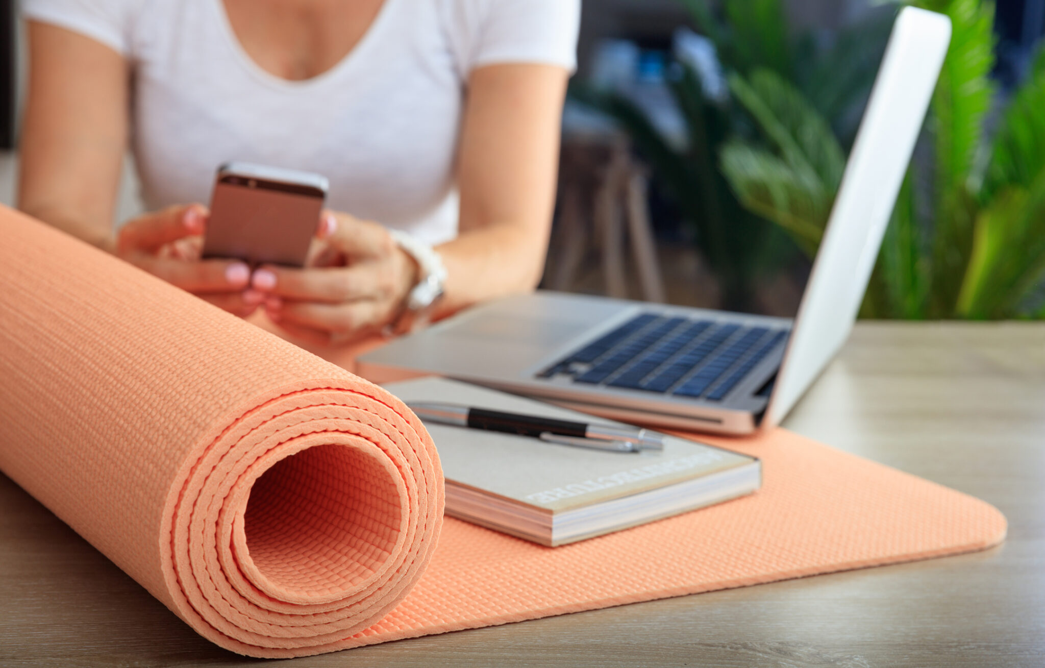 A woman researching different YTT certification programs