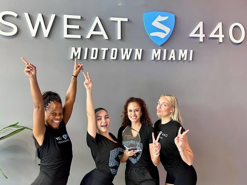 The Sweat 440 Miami team accepting the Mariana Tek Award for Most Popular (Member Growth Champions), recognizing their outstanding HIIT studio growth and expanding member community